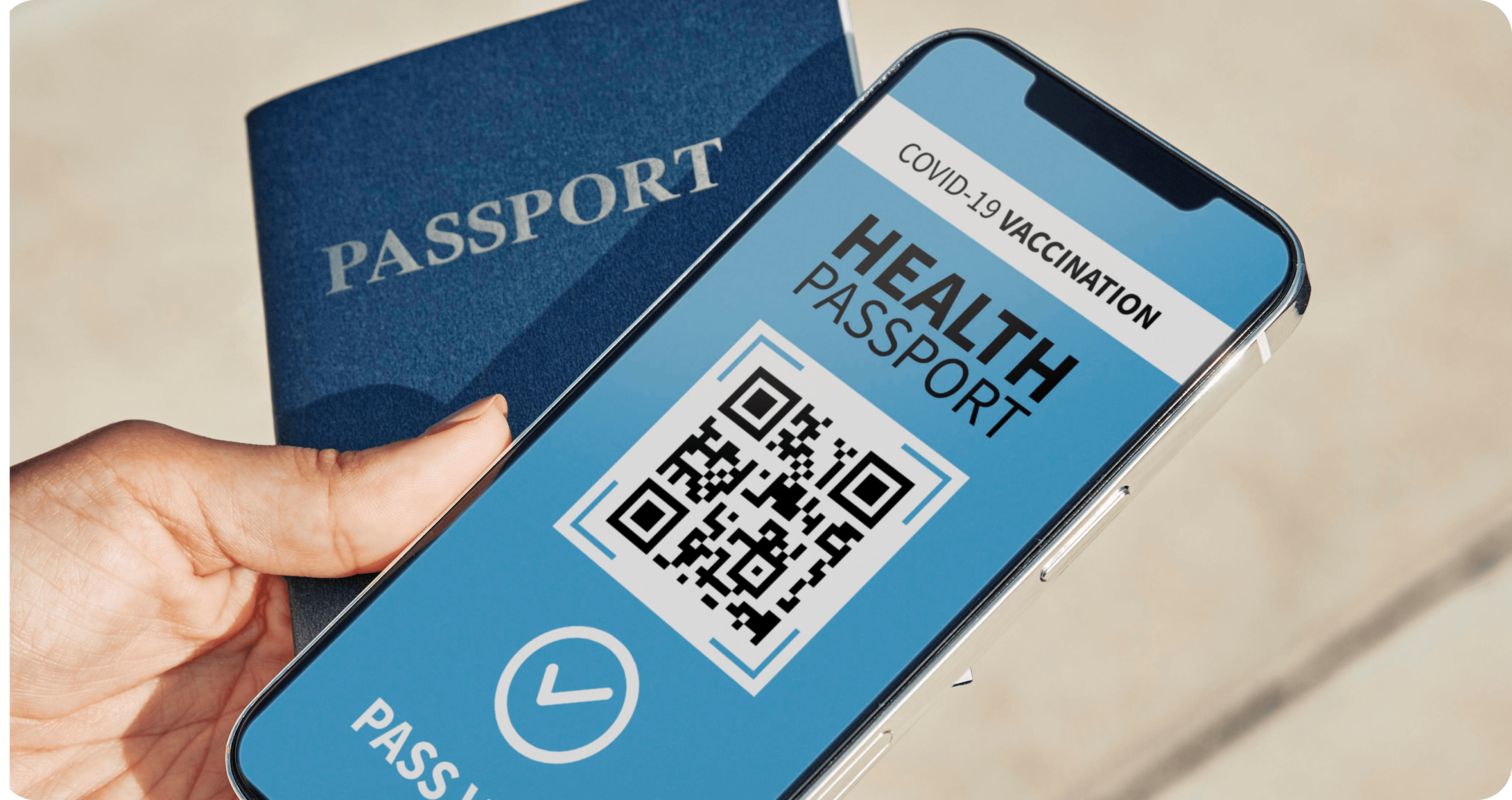 high-angle-person-holding-physical-virtual-health-passport-smartphone.png